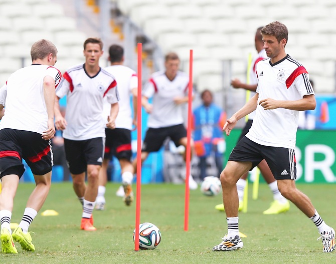 Thomas Mueller of Germany runs with the ball during the Germany training session