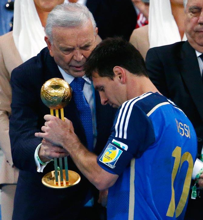 Lionel Messi is presented with the Golden Ball award