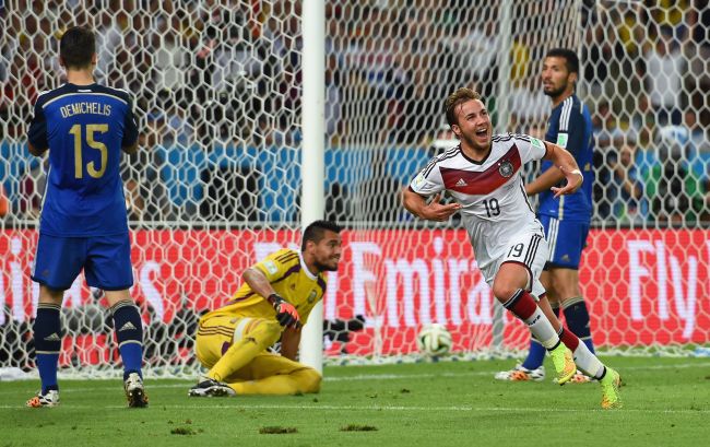 Mario Goetze of Germany celebrates scoring his team's first goal in extra time
