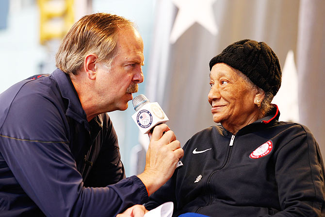 Sports Broadcaster Jon Naber speaks to 1948 Olympic gold medalist Alice Coachman during the Team USA Road to London 100 Days Out Celebration in Times Square on April 18, 2012 in New York City