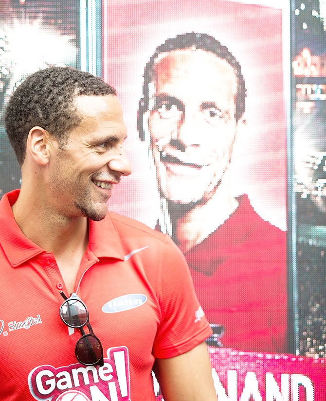 Rio Ferdinand greets supporters during a meet-the-fans session