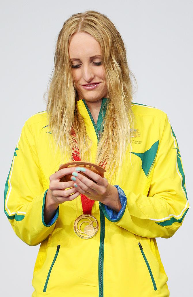 Gold medallist Taylor McKeown of Australia looks at her medal during the medal ceremony for the Women's 200m Breaststroke Final at Tollcross International Swimming Centre on Day 3 of the Glasgow 2014 Commonwealth Games on Saturday