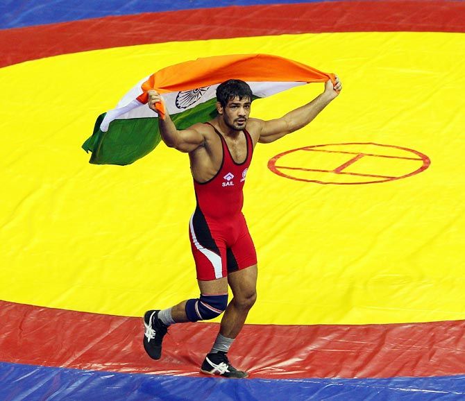 Sushil Kumar celebrates his gold in the 66 kg at the Commonwealth Games in New Delhi