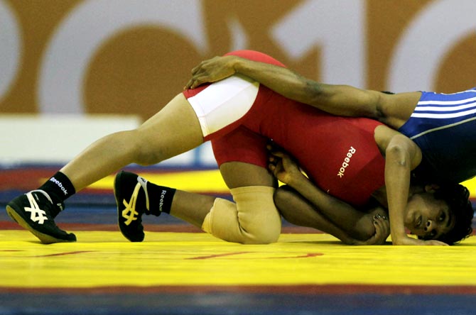 India's Babita Kumari (red) in action during the 2010 Commonwealth Games in Delhi