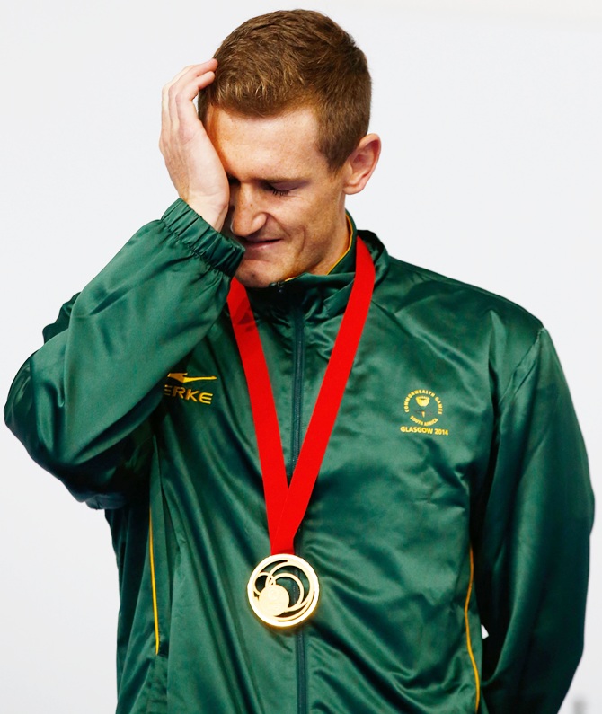 Gold medallist Cameron van der Burgh of South Africa gets emotional during the medal   ceremony for the Men's 50m Breaststroke Final at Tollcross International Swimming Centre during day five of the Glasgow 2014 Commonwealth Games