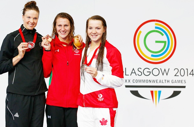 Gold medallist Jazz Carlin of Wales poses with silver medallist Lauren Boyle of New Zealand and bronze medallist Brittany Maclean of Canada during the medal ceremony for the Women's 800m Freestyle Final 