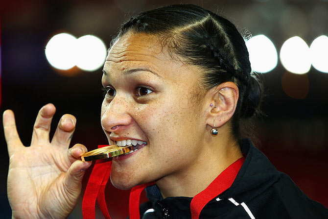 Gold medalist Valerie Adams of New Zealand poses on the podium during the medal ceremony for the Womens Shot Put at Hampden Park during day seven of the Glasgow 2014 Commonwealth Games on Wednesday