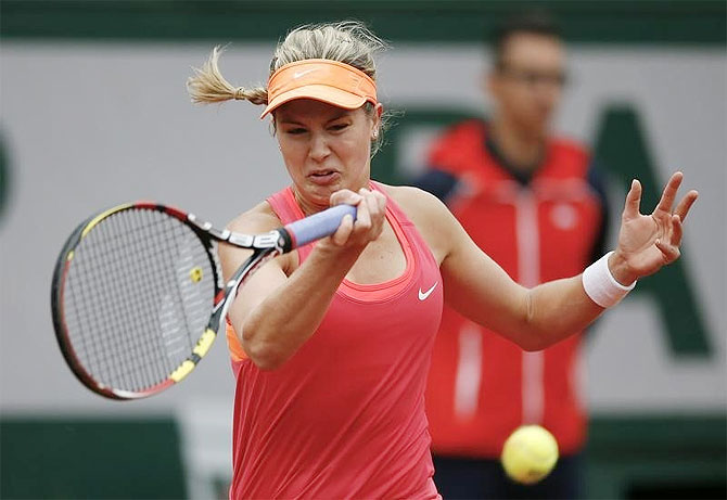 Eugenie Bouchard of Canada returns a forehand to Angelique Kerber of Germany during their women's singles match at the French Open tennis tournament at the Roland Garros stadium in Paris on Sunday
