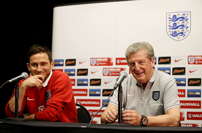 Frank Lampard (left) and manager Roy Hodgson talk to the media during an England press conference at The Sunlife Stadium in Miami, Florida on Tuesday