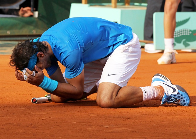 Rafael Nadal of Spain celebrates match point during the men's singles final against Roger Federer in 2011