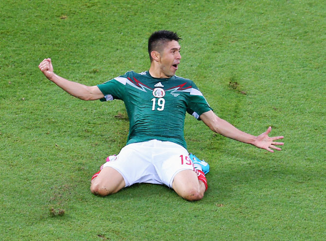 Oribe Peralta of Mexico celebrates his goal in the second half
