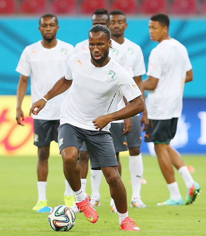 Didier Drogba runs with the ball during a Cote D'Ivoire training session at Arena Pernambuco in Recife, Pernambuco on Friday