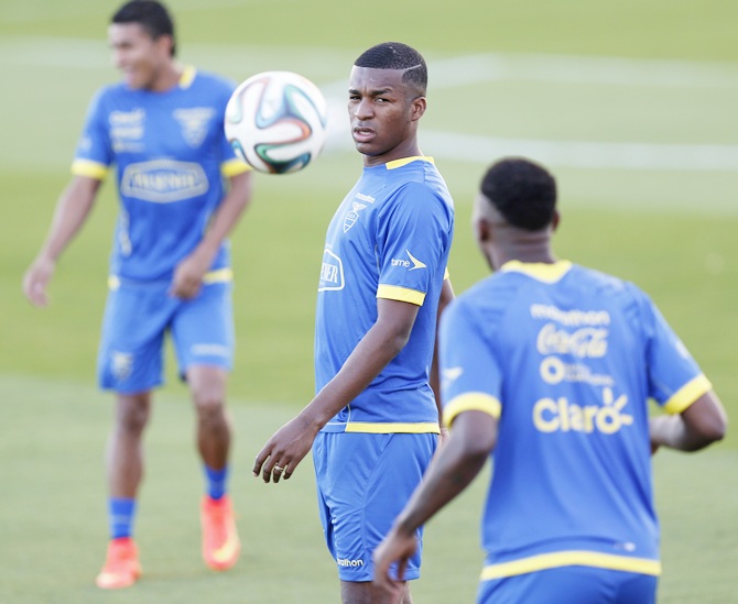 Ecuador's national soccer team player Erazo, centre, controls the ball during a training session in Brasilia