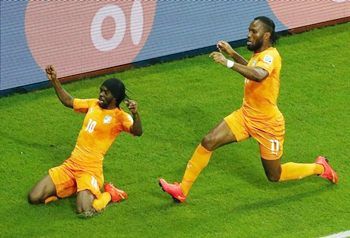 Ivory Coast's Gervinho (left) and Didier Drogba celebrate their goal against Japan
