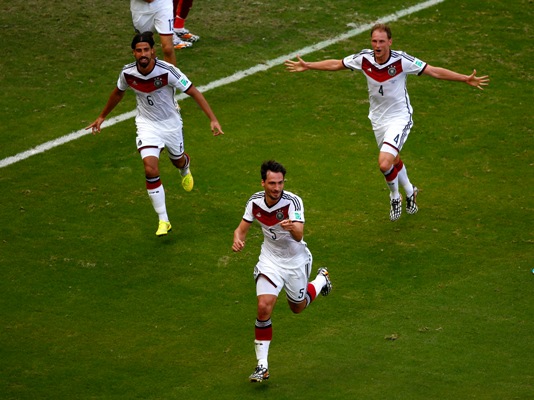 Mats Hummels of Germany (No 5) celebrates with teammates Sami Khedira (left) and Benedikt Hoewedes (right) after scoring his team's second goal
