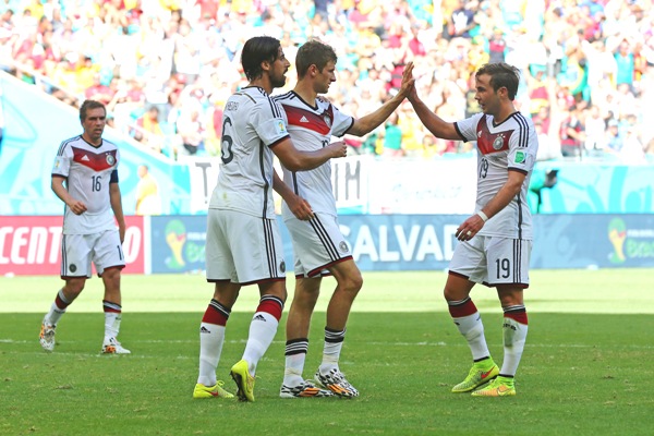 Thomas Mueller of Germany (second right) celebrates with teammates Sami Khedira (second left) and Mario Goetze (right) after scoring his team's third goal