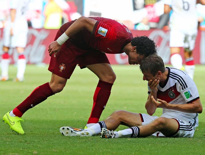 Pepe of Portugal headbutts Thomas Mueller of Germany resulting in a red card