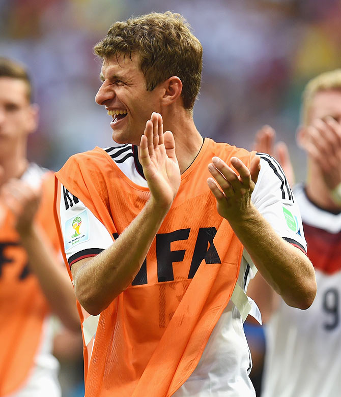 Thomas Mueller of Germany acknowledges the fans after scoring a hat-trick against Portugal