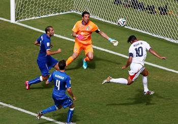Bryan Ruiz of Costa Rica scores his team's first goal on a header past Gianluigi Buffon of Italy