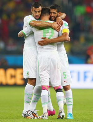 Algerian team celebrates the win over South Korea