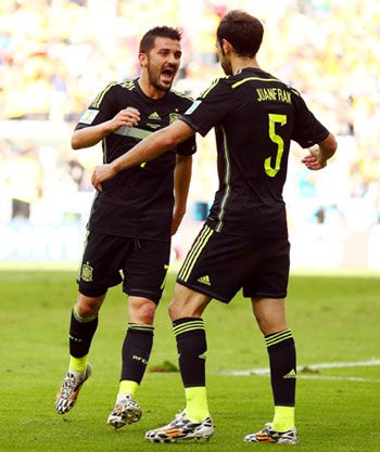 Spain's David Villa (left) celebrates scoring his team's first goal with Juanfran against Australia