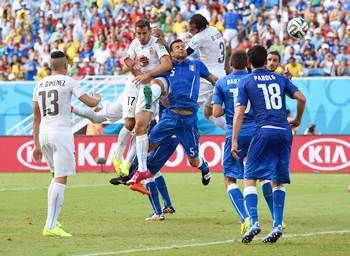 Diego Godin of Uruguay goes up for a header and scores against Italy.
