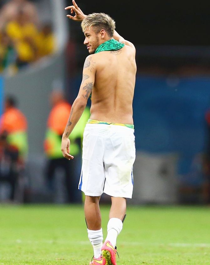Neymar of Brazil acknowledges the fans after defeating Cameroon