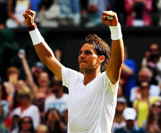 Rafael Nadal celebrates after winning his first round match