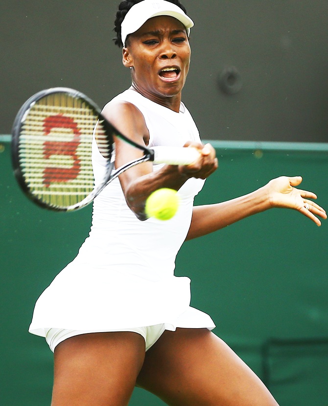 Venus Williams of the United States in action during her Ladies' Singles first round match against Maria-Teresa Torro-Flor of Spain