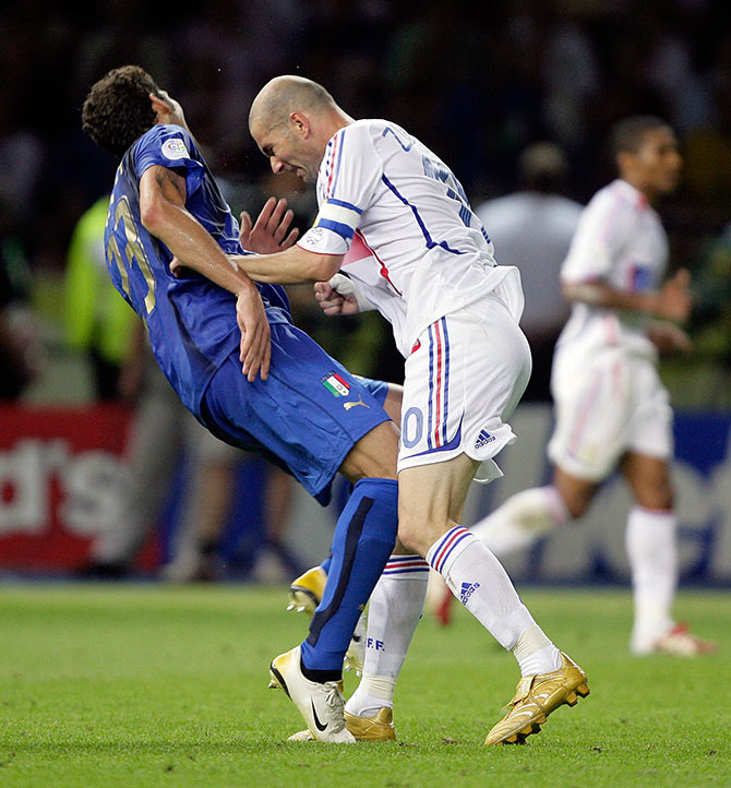 Italy's Marco Materazzi (left) falls on the pitch after being head-butted by France's Zinedine Zidane