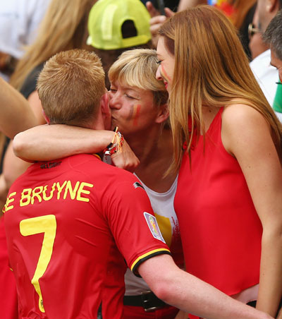 Kevin De Bruyne of Belgium receives a kiss after a 1-0 victory in the Group H match against Russia at Maracana