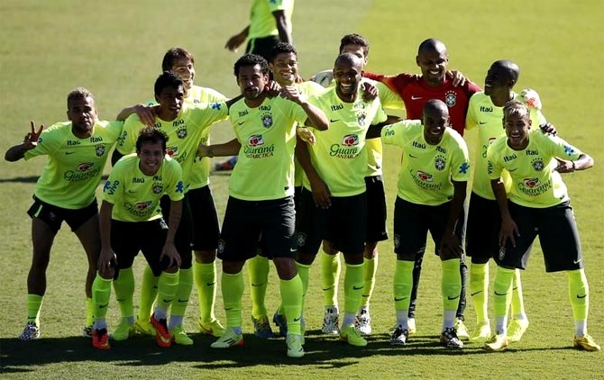 Brazil's players pose for the media during a training session
