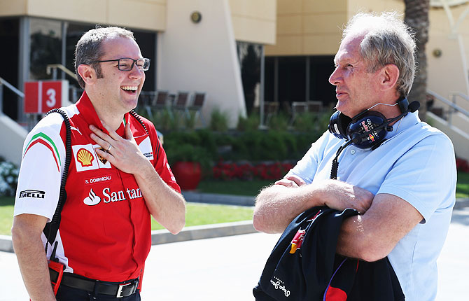 Ferrari Team Principal Stefano Domenicali (left) and Red Bull Motorsport Consultant Dr Helmut Marko  talk in the paddock