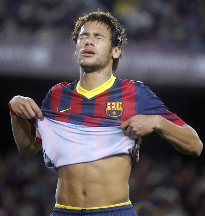 Barcelona's Neymar reacts after missing a goal.