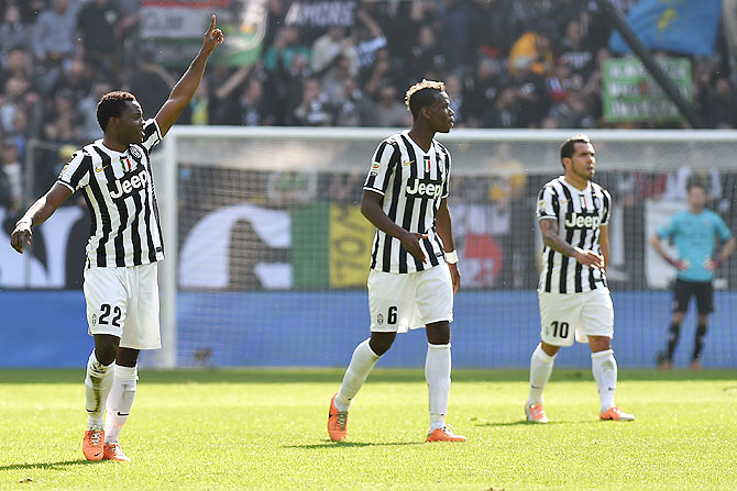Kwadwo Asamoah (left) of Juventus celebrates after scoring against Fiorentina during their Serie A match at Juventus Arena in Turin on Sunday