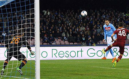Napoli's Jose Maria Callejon (centre) heads the ball and scores against AS Roma during their Serie A soccer match at San Paolo stadium on Sunday