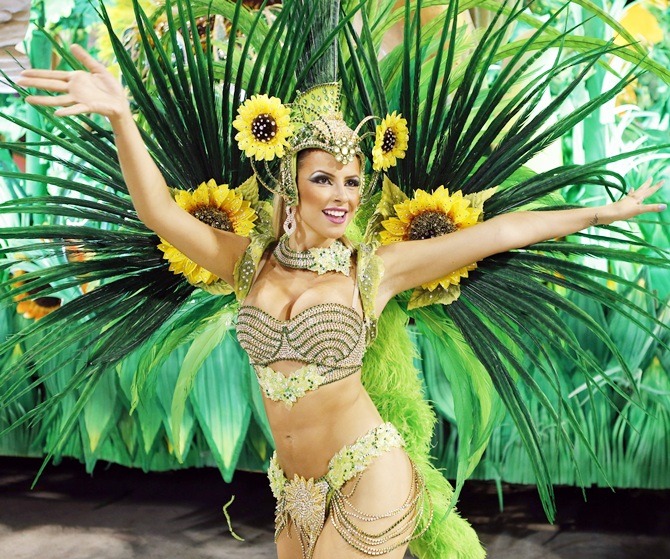 A reveller from the Vila Isabel samba school participates in the annual Carnival parade in Rio de Janeiro