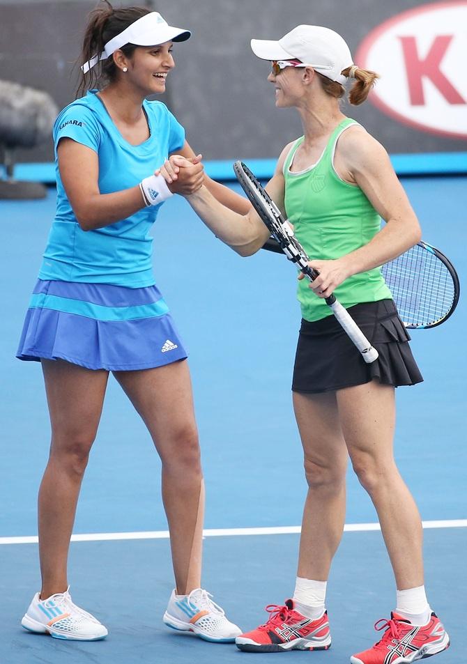 Sania Mirza of India and Cara Black of Zimbabwe celebrate