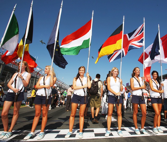 Grid girls hold the national flags of all of drivers nationalities before the Australian Formula One Grand Prix at the Albert Park Circuit on March 16, 2008
