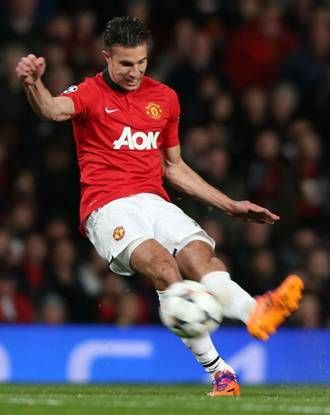 Robin van Persie scores their third goal during the UEFA Champions League Round of 16 second leg match between Manchester United and Olympiacos FC at Old Trafford 