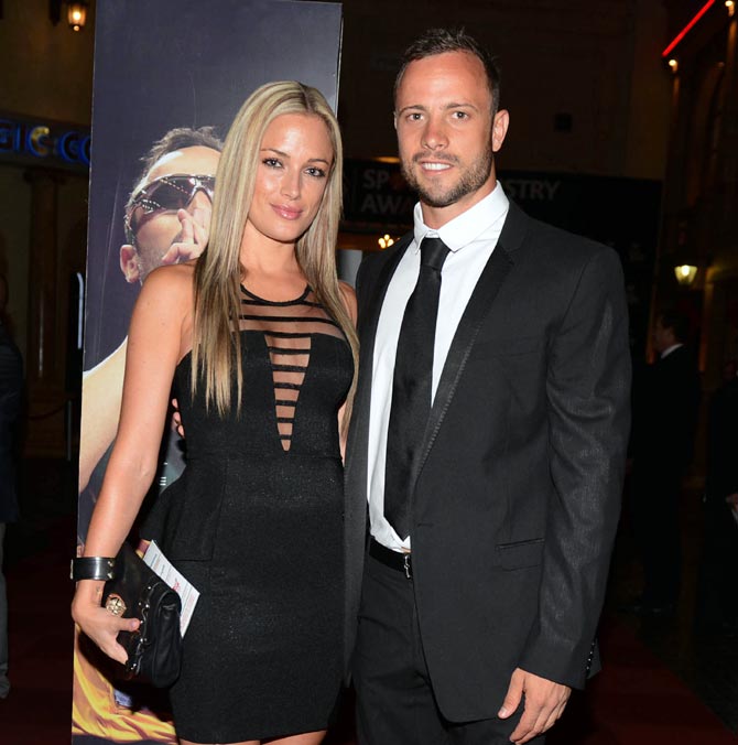 Oscar Pistorius, right, and his late girlfriend Reeva Steenkamp pose for a picture in Johannesburg, on February 7, 2013