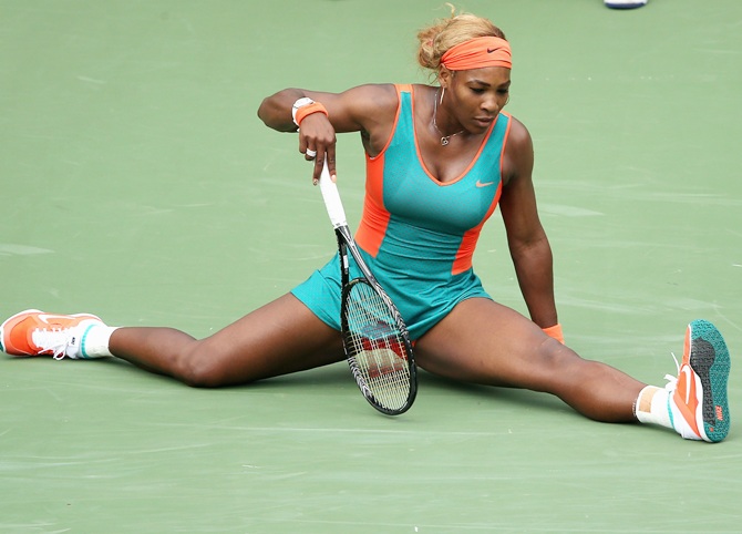 Serena Williams of the United States does the splits