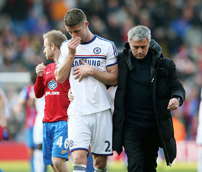 Chelsea manager Jose Mourinho consoles a dejected Gary Cahill following their 1-0 defeat to Crystal Palace during their English Premier League match at Selhurst Park in London on Saturday