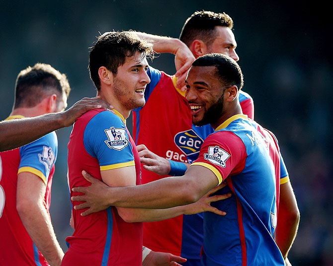 Joe Ledley and Adrian Mariappa of Crystal Palace celebrate after taking the lead against Chelsea on Saturday