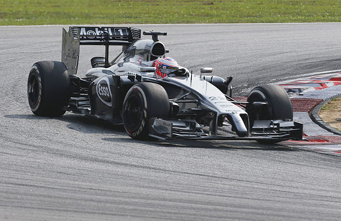 McLaren Formula One driver Jenson Button of Britain takes a corner during the Malaysian F1 Grand Prix at Sepang International Circuit on Sunday