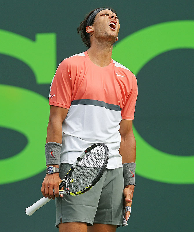 Rafael Nadal of Spain reacts on losing a point against Novak Djokovic of Serbia on Sunday