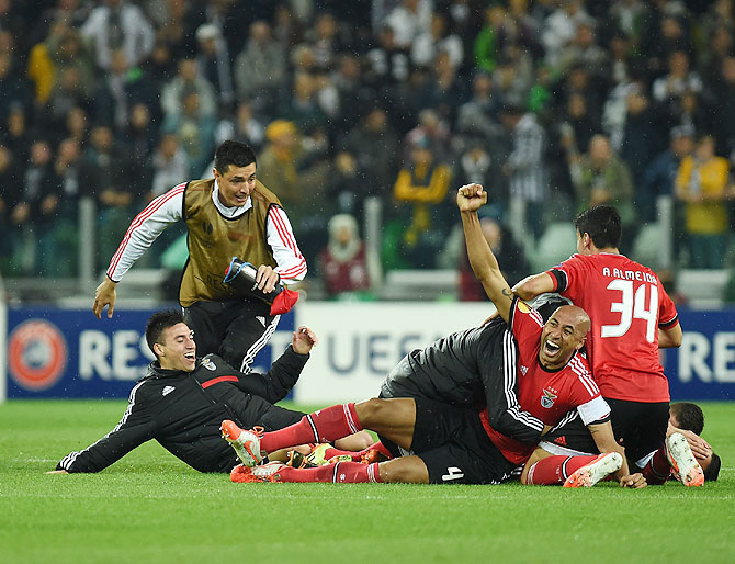 Luisao (right) of Benfica celebrates with teammates at the end of their UEFA Europa League semi-final against Juventus at Juventus Arena in Turin on Thursday