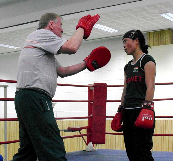 MC Mary Kom (right) with her coach, Charles Atkinson
