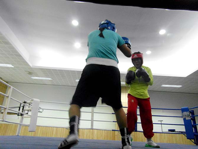 MC Mary Kom (right) during a training bout against Jamuna Devi
