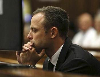 South African Olympic and Paralympic athlete Oscar Pistorius sits in the dock during his murder trial in the North Gauteng High Court in Pretoria